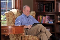 Mark Putnam  works on his iPad, an example of the technology changing our lives.