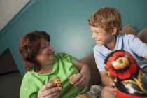 Barb Watson ’83 and her adopted  son Danny play with nesting dolls from his home country.