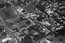 In this photo, things are starting to look current: the library has been built, the Pond adds its graceful shape to campus. Until you spot the football field where Vermeer Science Center should be. And those pesky railroad tracks are still there!