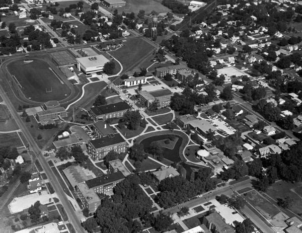 In this photo, things are starting to look current: the library has been built, the Pond adds its graceful shape to campus. Until you spot the football field where Vermeer Science Center should be. And those pesky railroad tracks are still there!